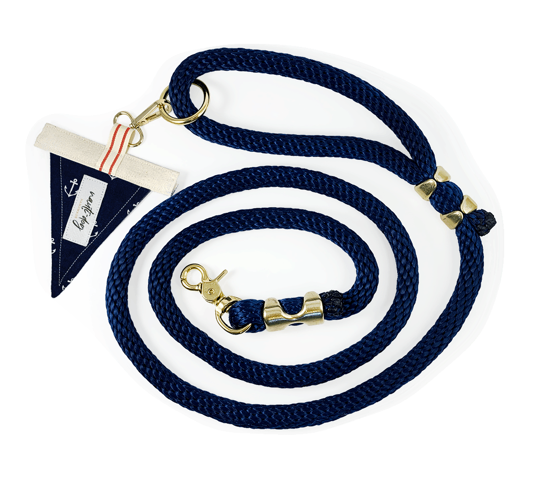 navy marine-grade rope leash with solid brass hardware and small nautical anchor flag accent