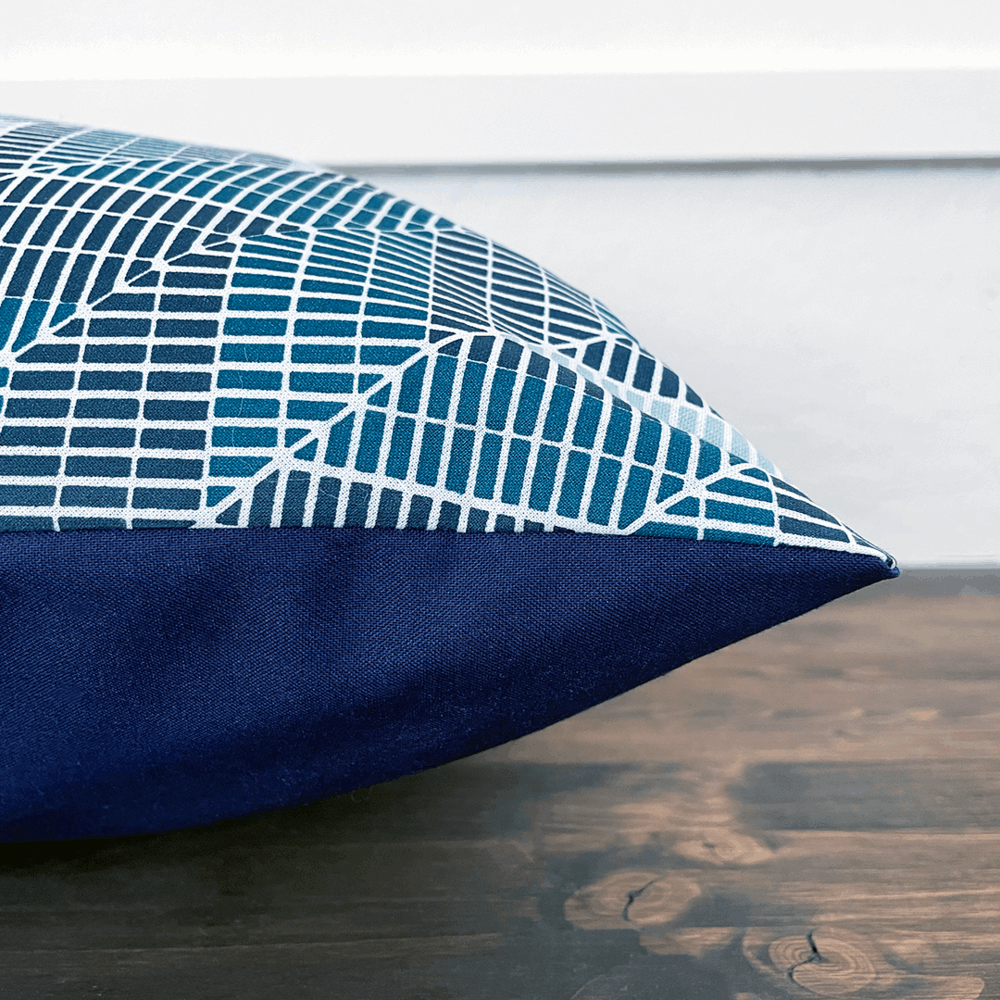 navy teal and white geometric diagonal herringbone pillow-side view